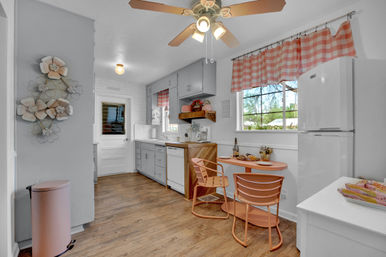 The Pink Haus: Luxe 3BR Retreat 1 Mile from Main Street with Firepit & Cozy Design image 3