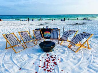 Beach Bonfire Party with Attendant to Group, Setup with Tables & Chairs, S’mores, Tiki Torches, & Bluetooth Speaker Included image