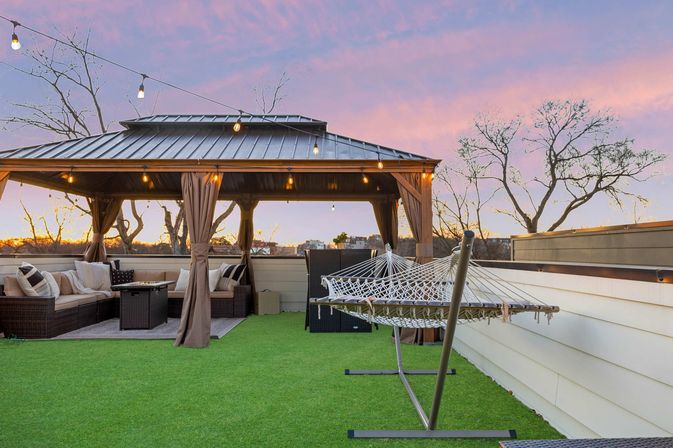 The Lyric: Modern 4-Bedroom Retreat with Rooftop Access and Fire Pit image 4