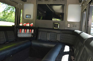 Luxury on Wheels: 12-Passenger Limo Van with Wrap-Around Seating, Uniformed Chauffeur & Optional Drink Packages image 3