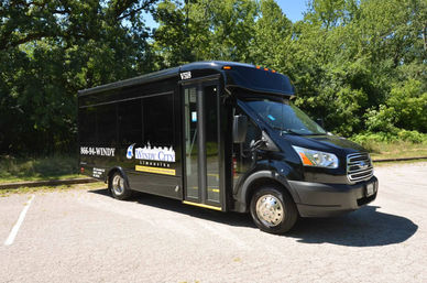 Luxury on Wheels: 12-Passenger Limo Van with Wrap-Around Seating, Uniformed Chauffeur & Optional Drink Packages image 2