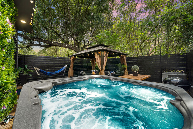 The Black House: Downtown Escape with Hot Tub, Chef, Stylish Decor, Massage & Mixology Class image 37