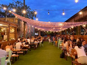 All-You-Can-Drink Rooftop Party at Happy Camper Chicago with Bottomless Pizza, Appetizers, and Salad Options image