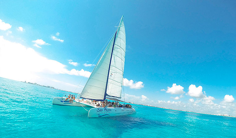 Isla Mujeres Catamaran Sailing Tour: Open Bar, Snorkeling, Beach Club + Lunch image 1