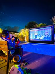 Movie Night Under the Stars: Complete Setup with Screen, Projector, Fresh Popcorn & More image 1