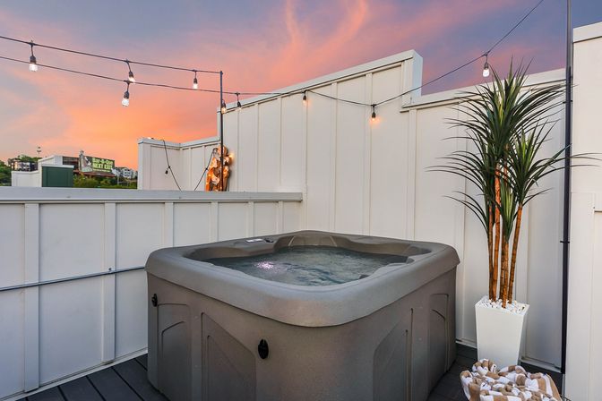 Bourbon and Bubbles: Retro Speakeasy-Style Home with Rooftop Hot Tub image 60