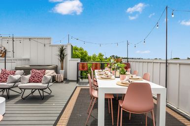 Bourbon and Bubbles: Retro Speakeasy-Style Home with Rooftop Hot Tub image 5