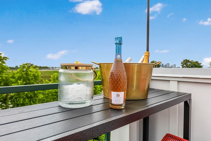 Bourbon and Bubbles: Retro Speakeasy-Style Home with Rooftop Hot Tub image 10