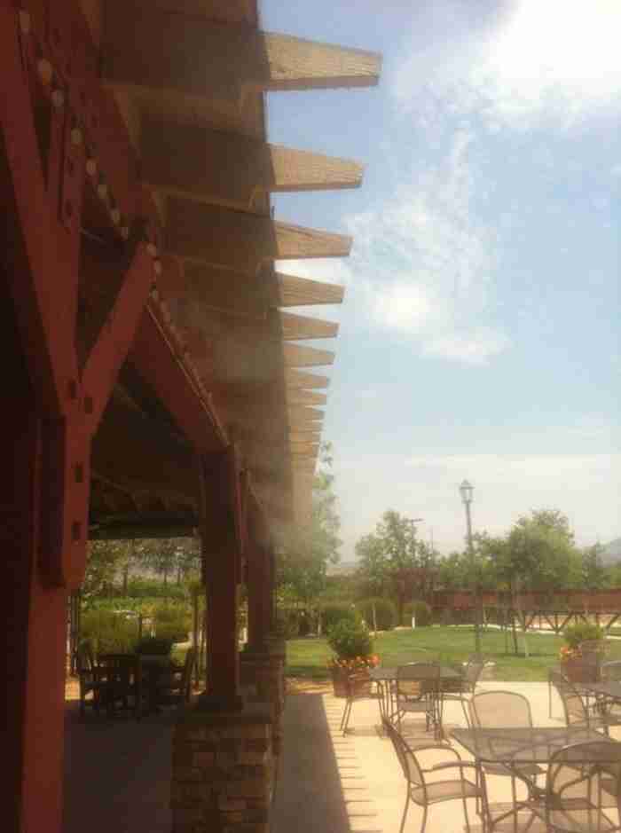 Misting at an outdoor winery wedding venue