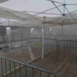 Big Fogg Portable Misting Fans at work under the campaign tents.
