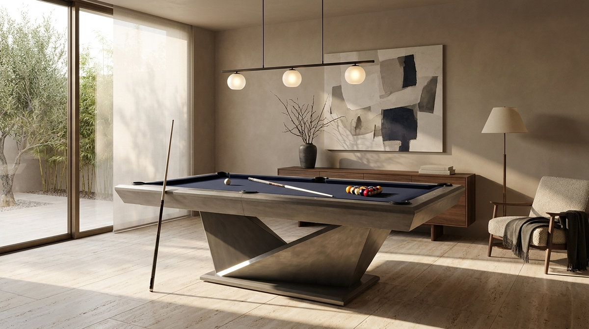 A pool table with a sculptural base under a linear pendant