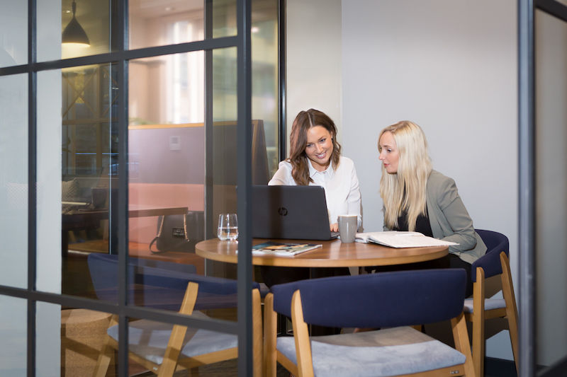 two ladies coworking- on Tally Workspace