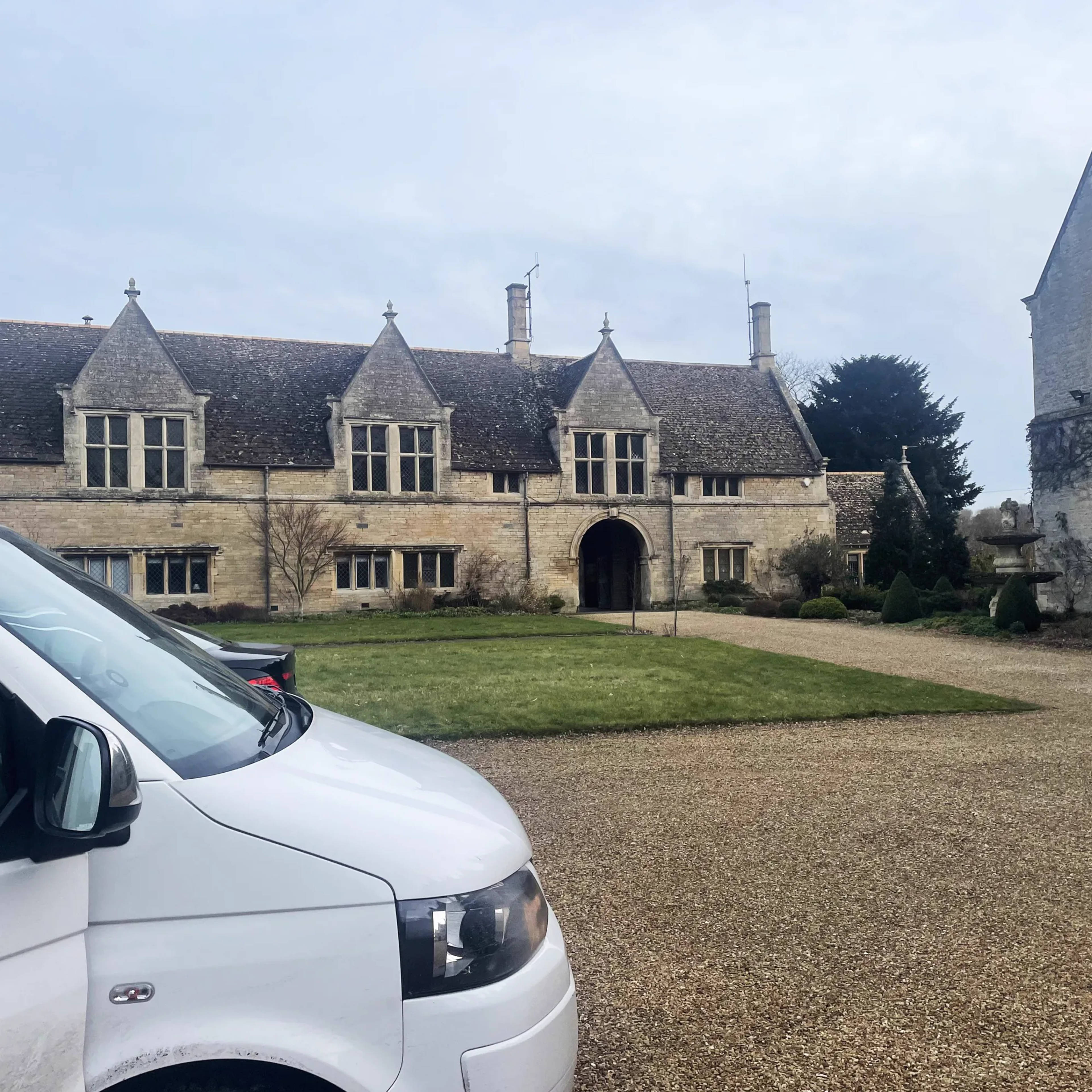 A Clear House Moves van at a Sussex stone manor house