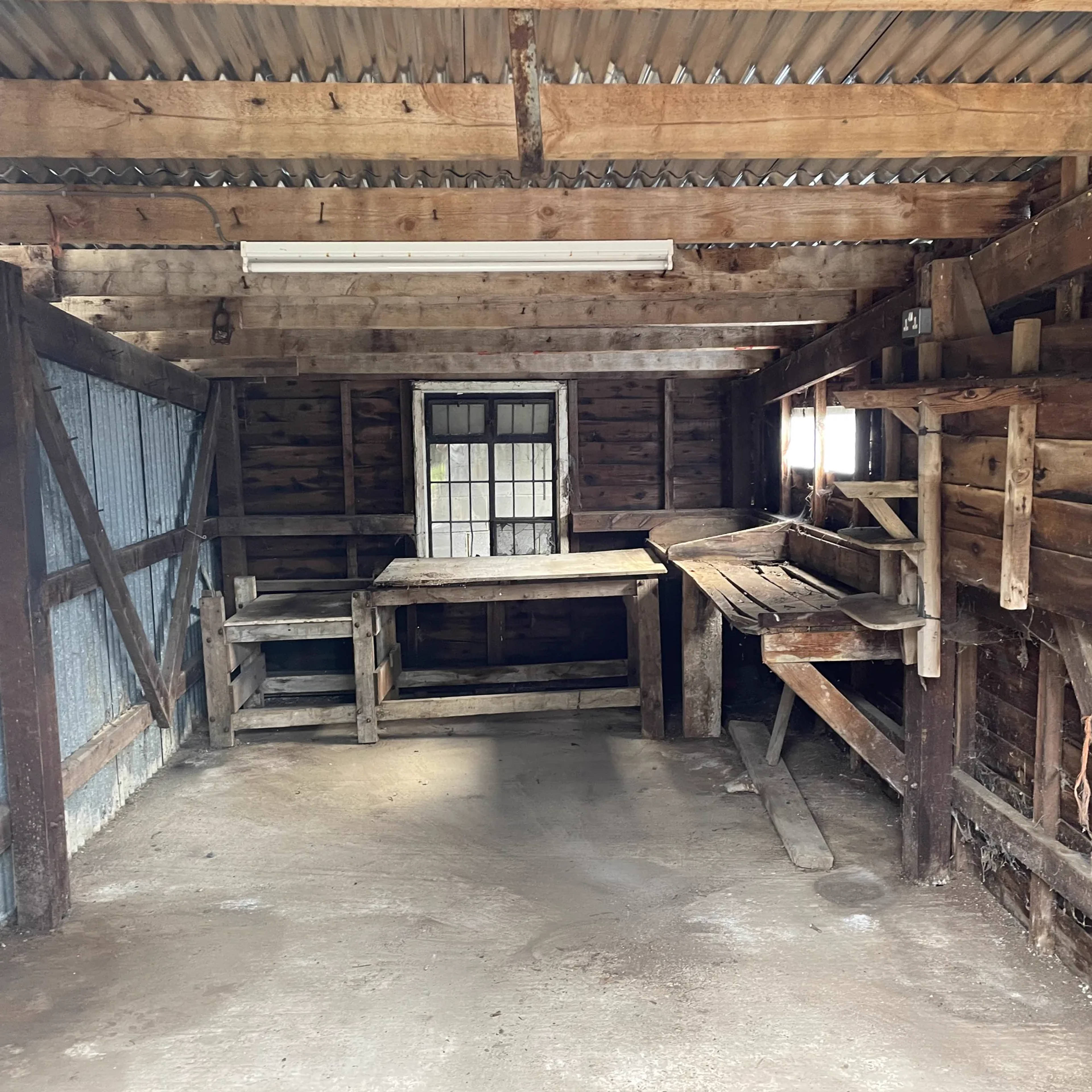 A timber barn emptied and swept after a full clearance