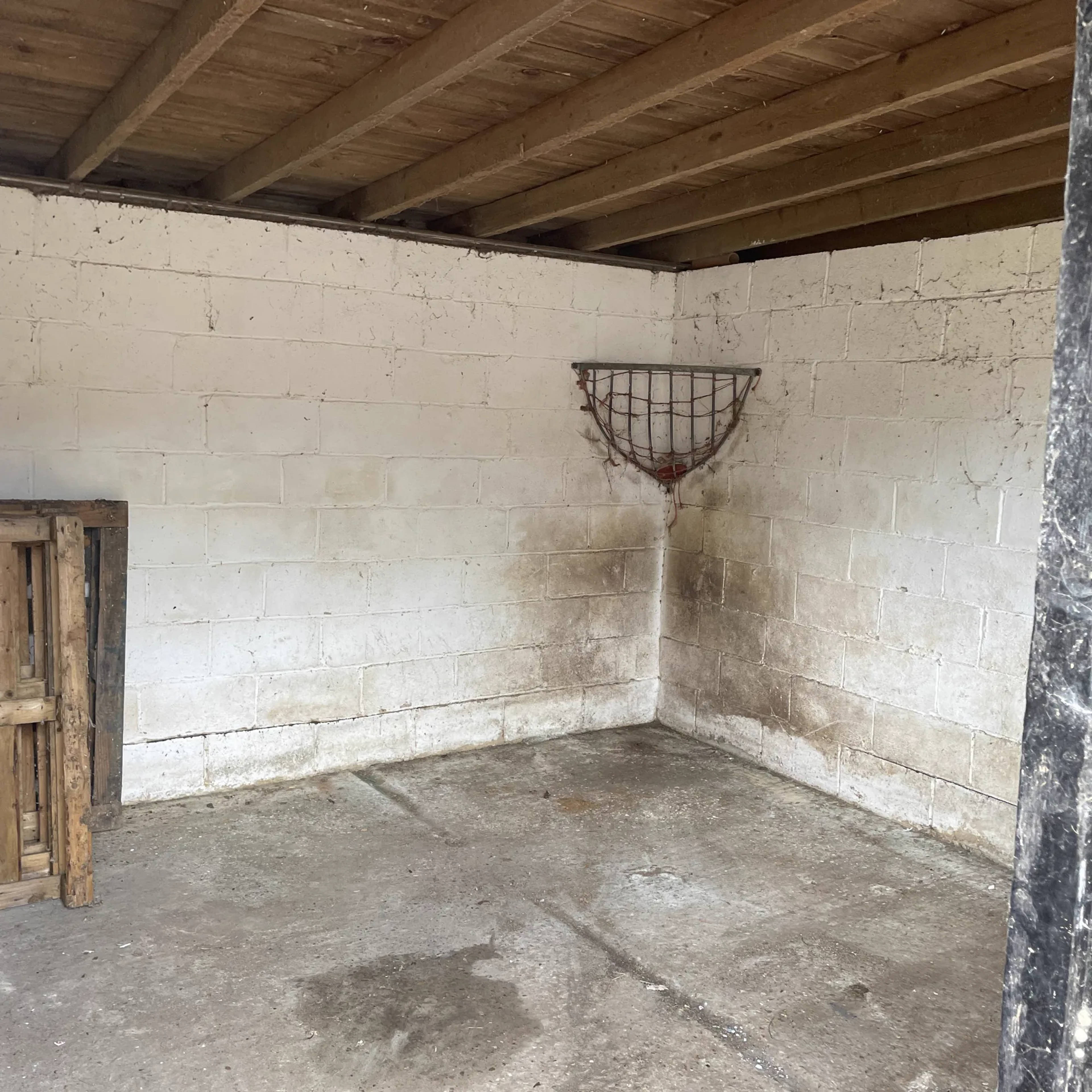 A garage left clean and empty after a house clearance