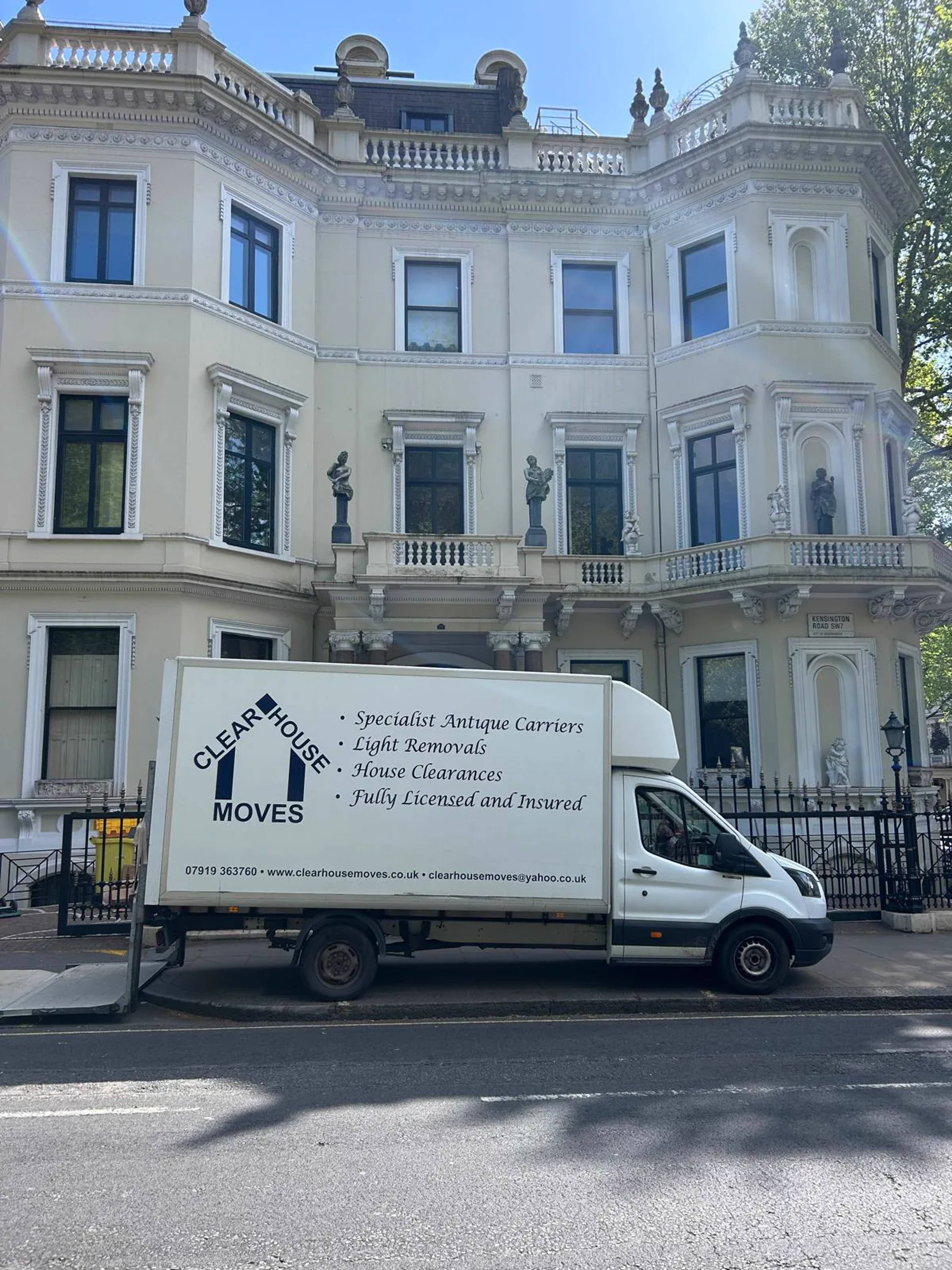 A Clear House Moves Luton van outside a grand white stucco London mansion