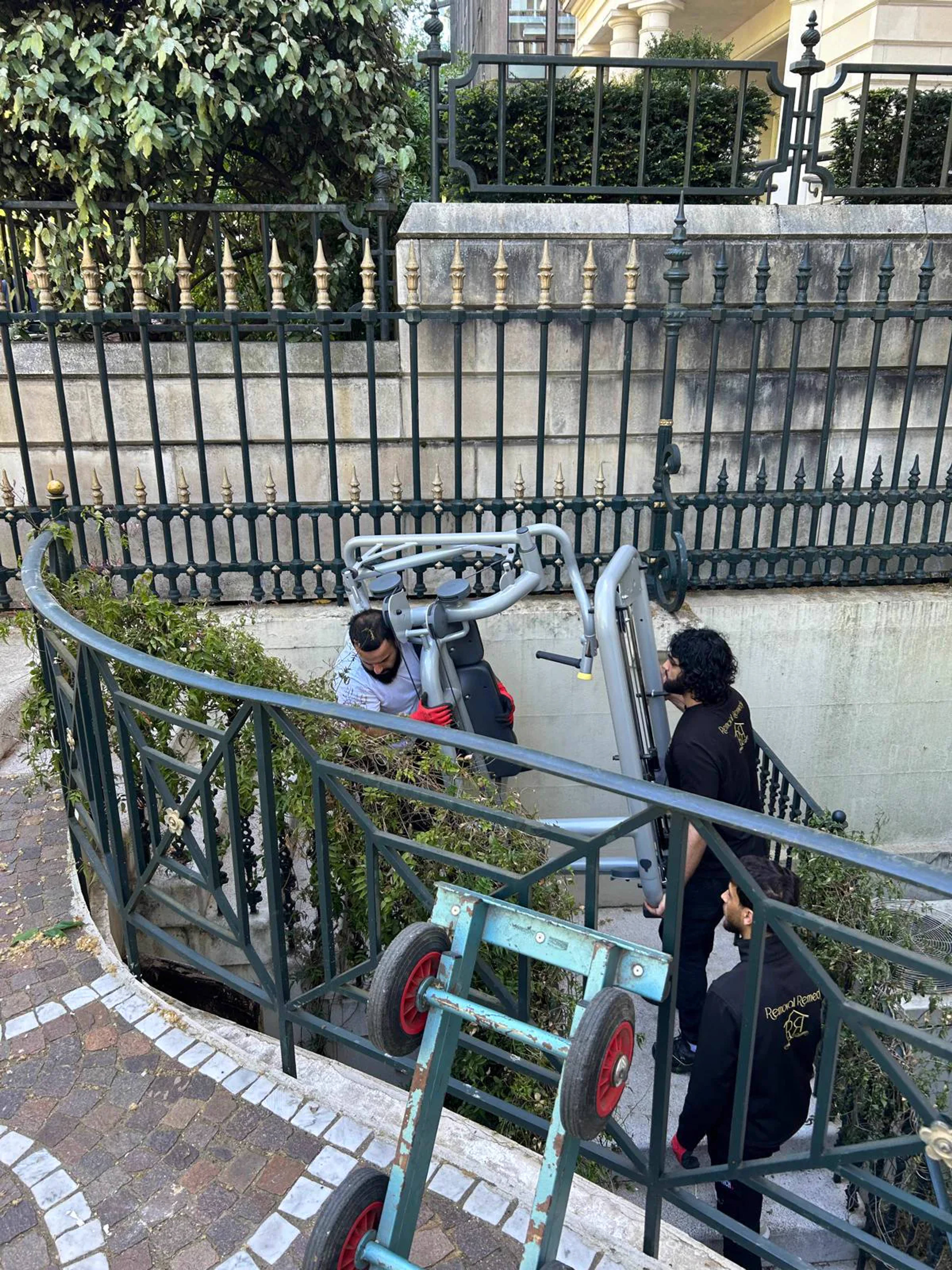 Clear House Moves using specialist equipment to move a heavy item down steps in London