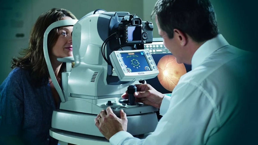 Alberta Vision Care - lady giving an eye exam