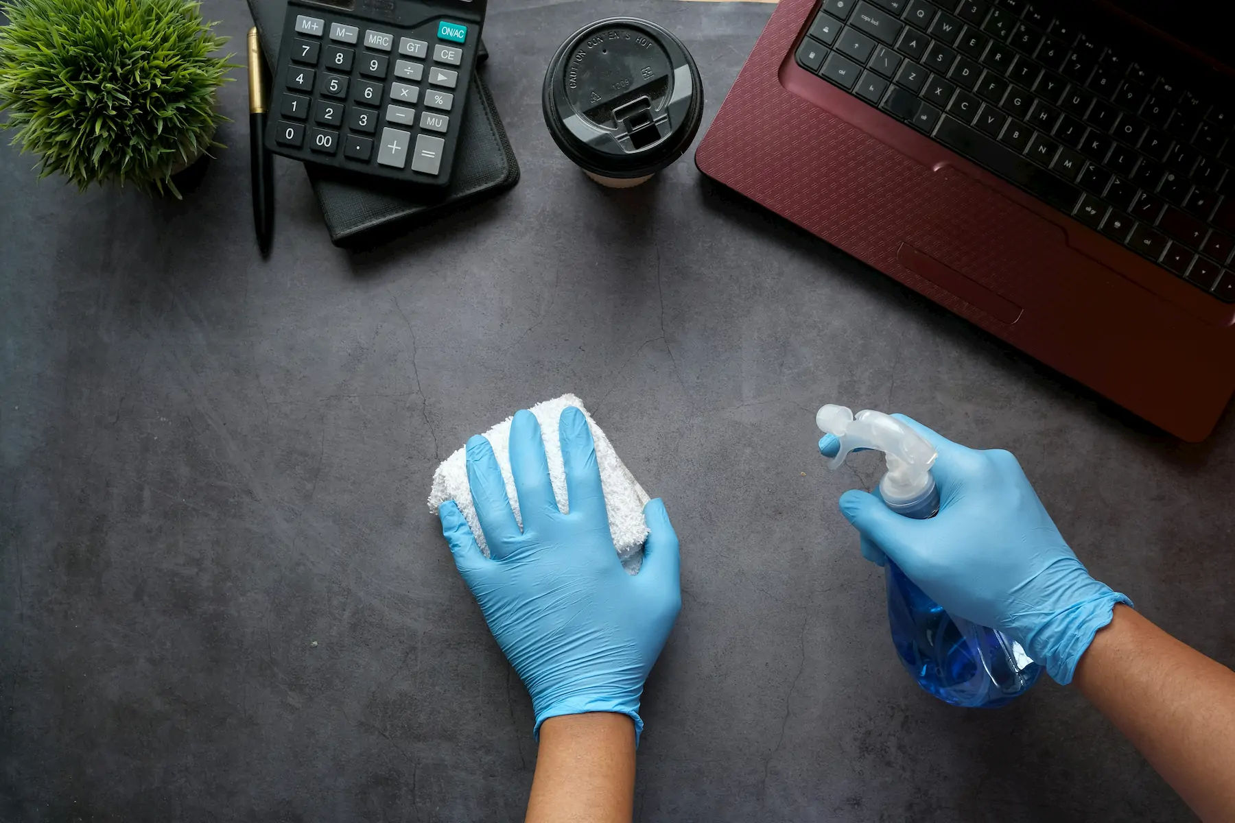 Professional cleaner spraying a surface with a natural cleaning product