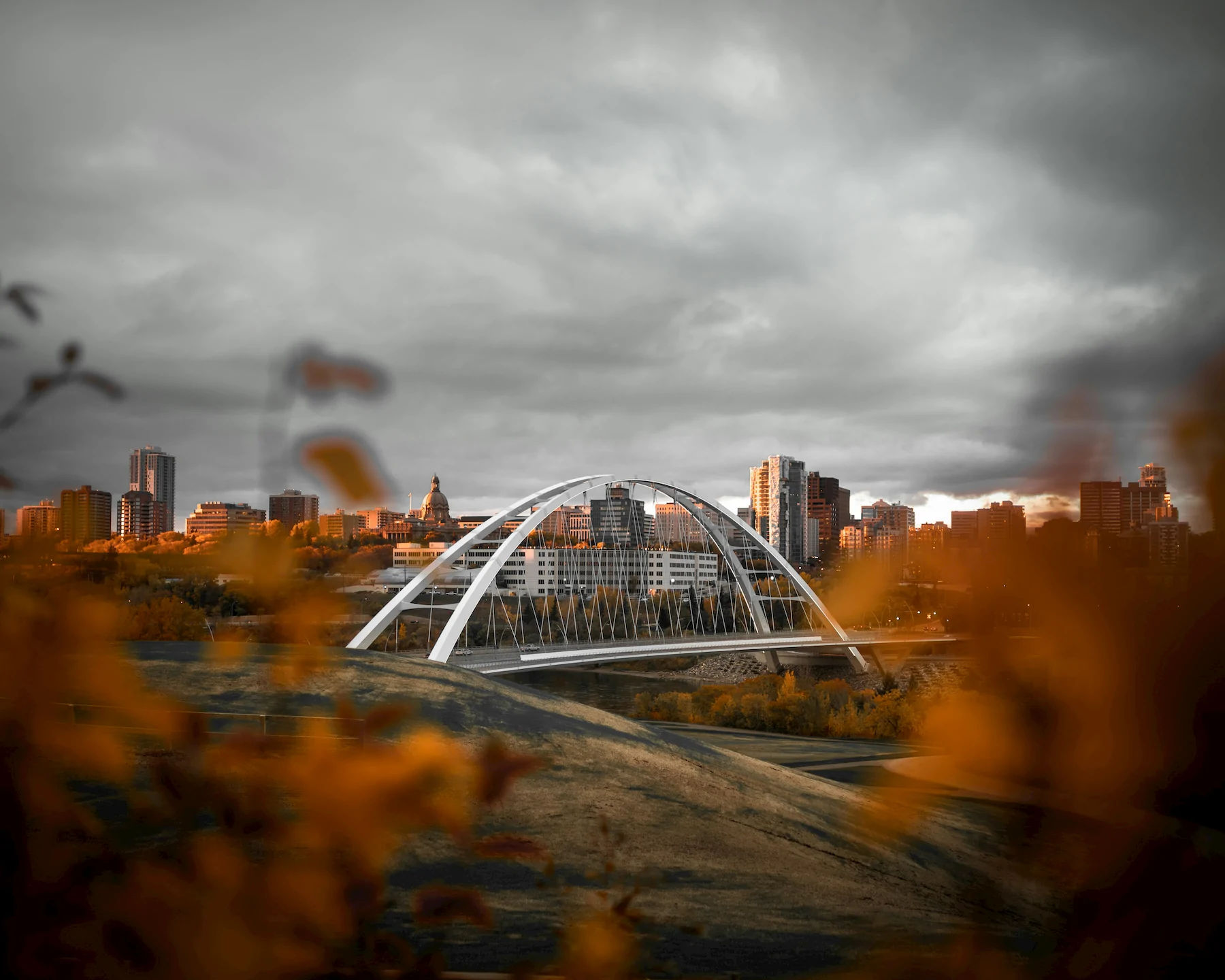 Walterdale Bridge and the Alberta Legislature dome in Edmonton, framed by autumn leaves