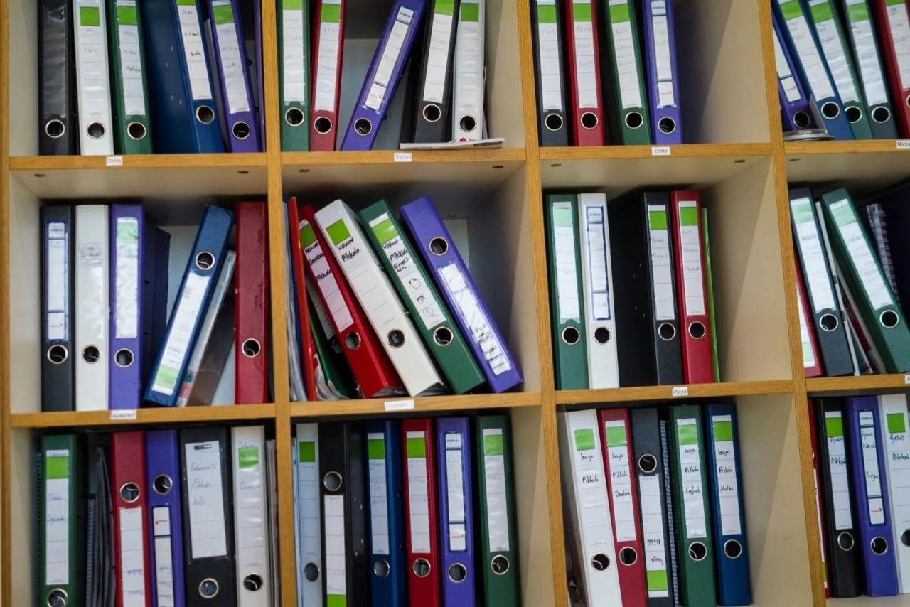 Shelves of labelled ring binders