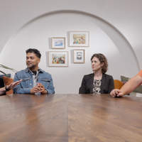 BibleProject scholars sitting at a table having a discussion.