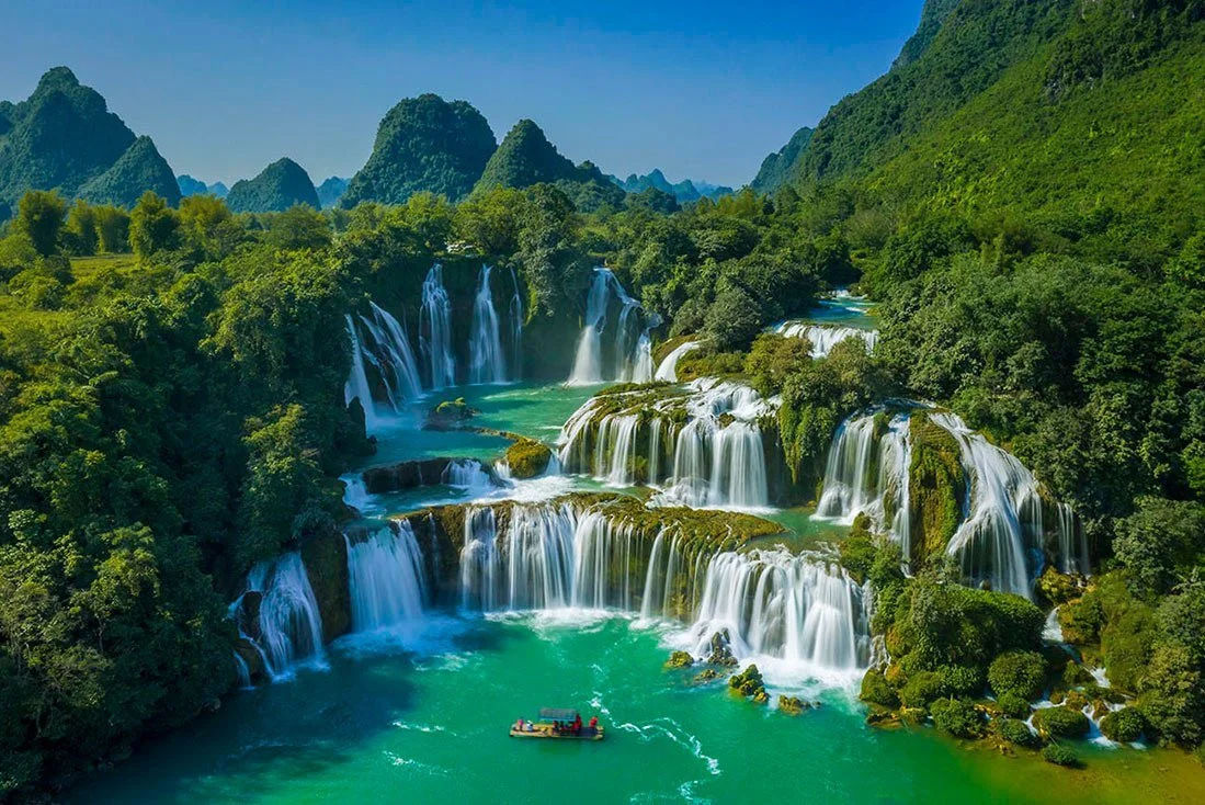 Ban Gioc Waterfall with multiple cascading tiers stretching across hundreds of meters