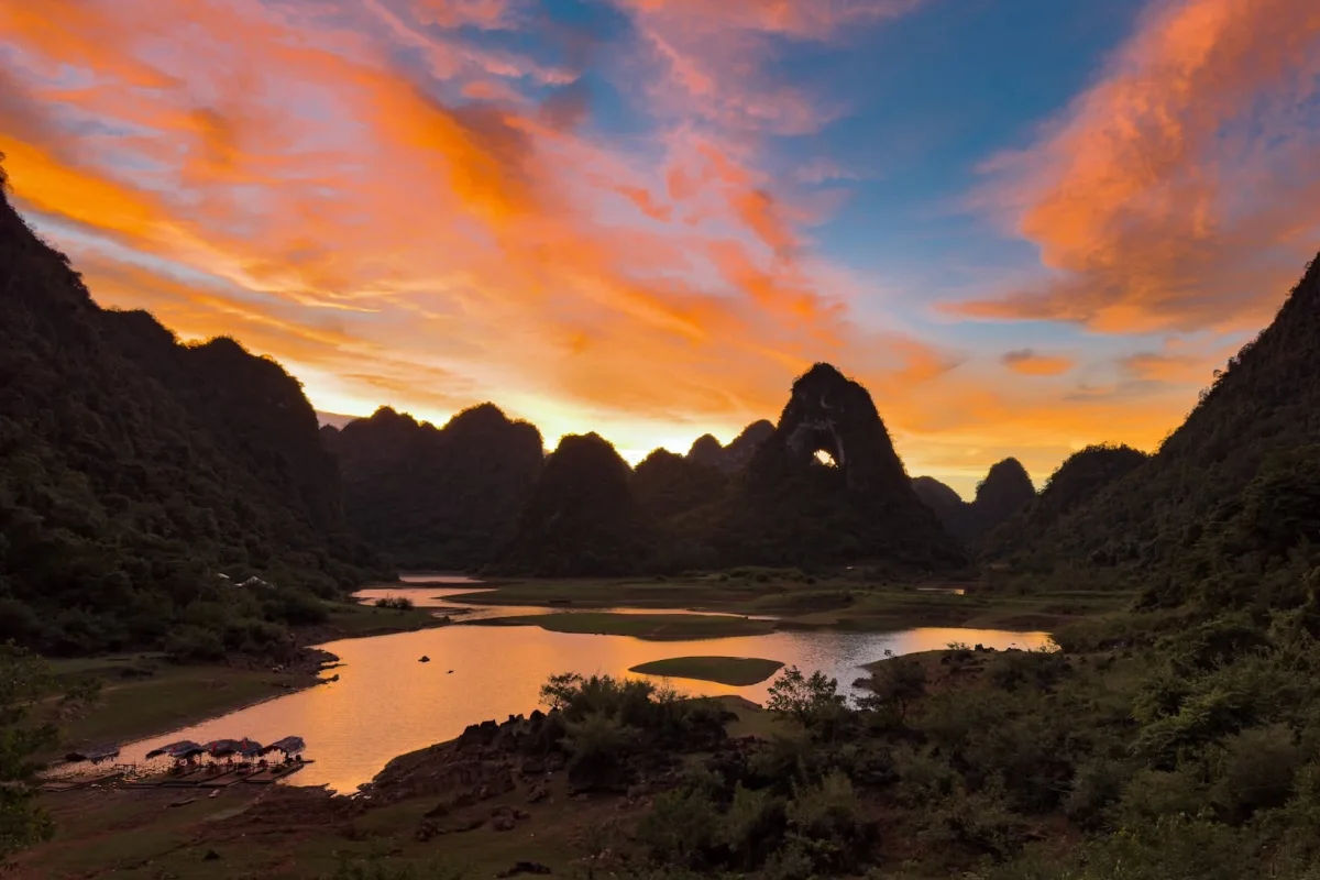 Nui Mat Than and calm lake scenery at sunset