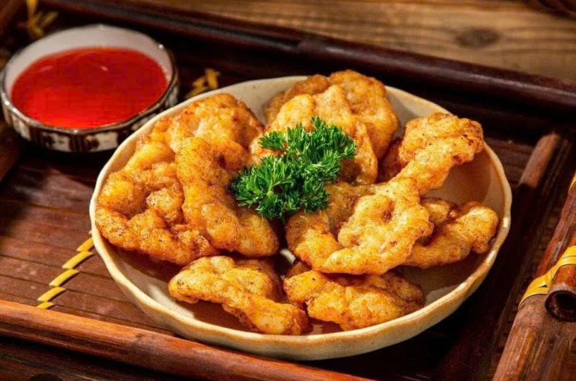 Hand-pounded Ha Long squid patties fried golden and crispy while retaining their chewy texture