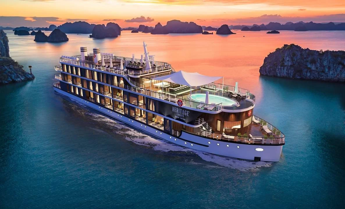Cruise taking visitors around Ha Long Bay among majestic limestone islands