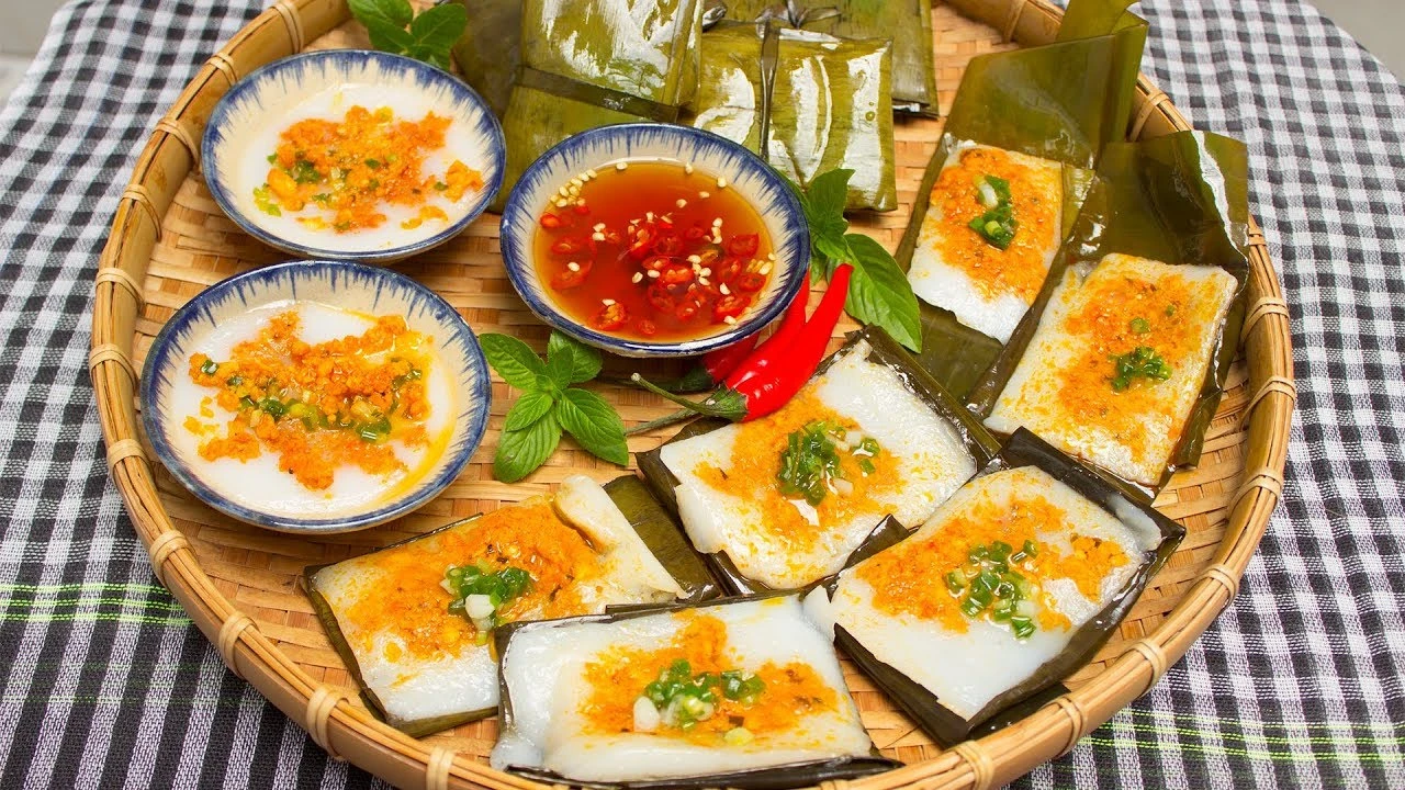 A tray of Hue cakes including Banh Beo, Banh Nam, and Banh Loc with dried shrimp and scallion oil
