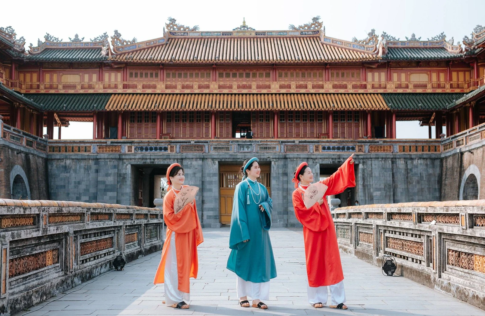 Travelers visiting historical and cultural attractions in the ancient capital of Hue
