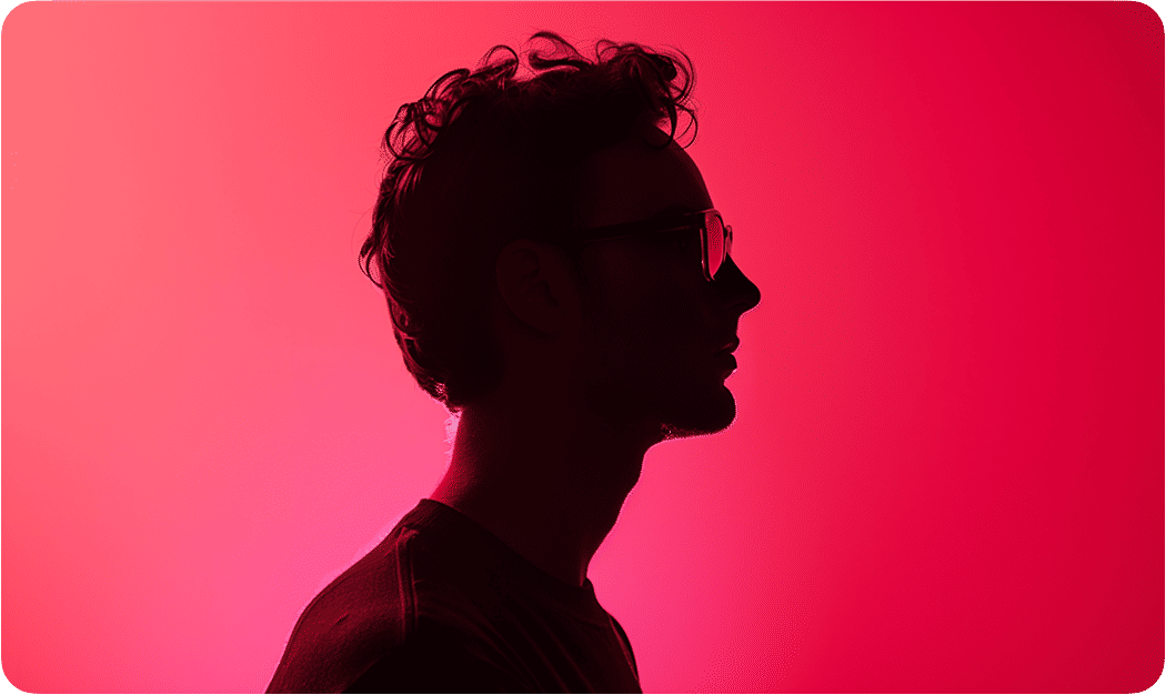 A contemplative silhouette against a pink and purple fluid background