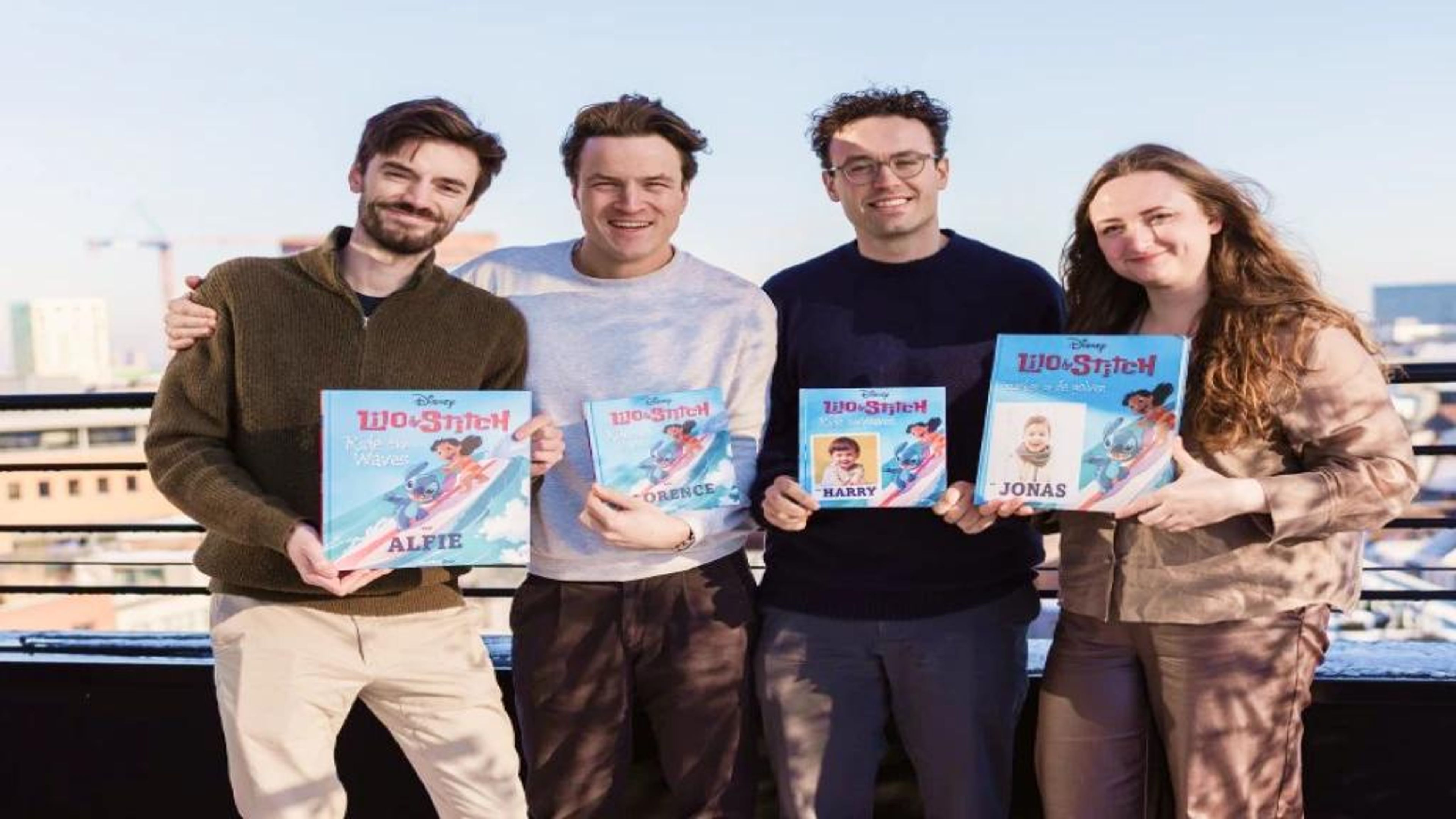 BubblyDoo team holding personalized books