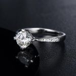 1.00CT MOISSANITE ENGAGEMENT RING, FOUR CLAW SHOULDER SET DESIGN