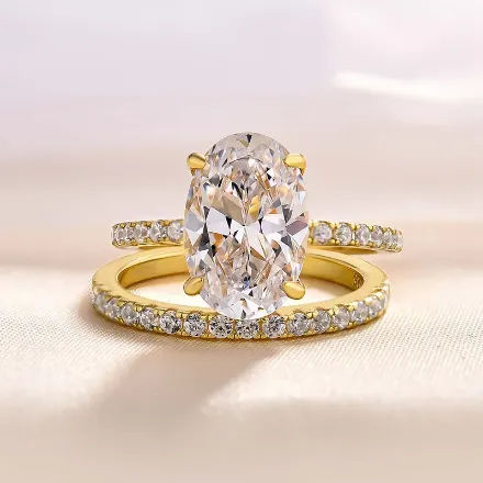 Picture of Yellow Gold Oval Cut Simulated Diamond Wedding Ring Set In Sterling Silver