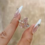 Picture of Elegant Rose Gold Pear Cut Pink Sapphire Three Stone Engagement Ring In Sterling Silver