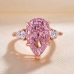 Picture of Elegant Rose Gold Pear Cut Pink Sapphire Three Stone Engagement Ring In Sterling Silver