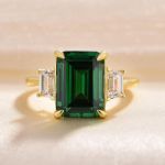 Picture of Yellow Gold Emerald Green & White Sapphire Emerald Cut Three Stone Engagement Ring In Sterling Silver