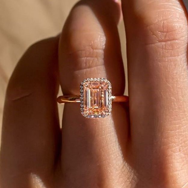 Picture of Exclusive Rose Gold Halo Emerald Cut Padparadscha Engagement Ring In Sterling Silver