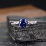 Picture of Classic Twist 1.25 Carat Round Cut Blue Sapphire Engagement Ring For Her In Sterling Silver