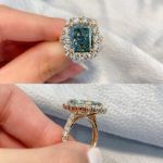 Picture of Gorgeous Yellow Gold Halo Radiant Cut Montana Blue Sapphire Engagement Ring In Sterling Silver