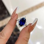 Picture of Gorgeous Halo Split Shank Oval Cut Blue Sapphire Engagement Ring In Sterling Silver