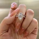 Picture of Rose Gold 2.2 Carat Halo Pear Cut Lab Created White Sapphire Wedding Ring Set