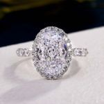 Picture of Exclusive Halo Oval Cut Moissanite Diamond Engagement Ring In Sterling Silver