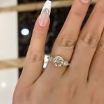 Picture of Exclusive Yellow Gold Round Cut Three Stone Engagement Ring In Sterling Silver