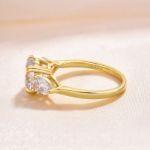 Picture of Exclusive Yellow Gold Round Cut Three Stone Engagement Ring In Sterling Silver