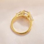 Picture of Exclusive Yellow Gold Round Cut Three Stone Engagement Ring In Sterling Silver