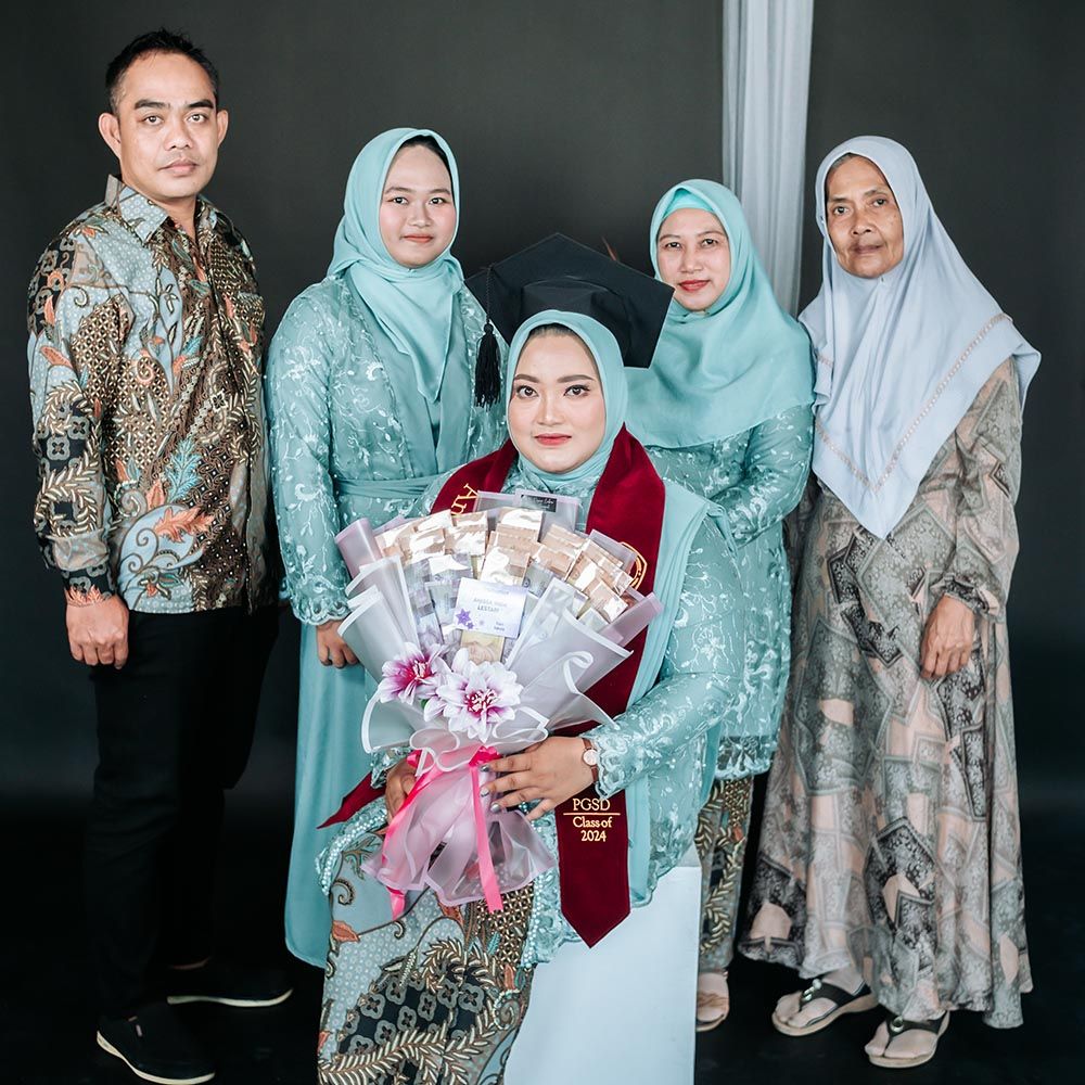 Graduate embraced by proud parents wearing traditional formal attire all smiling warmly with emotions of achievement and family pride during outdoor photo session