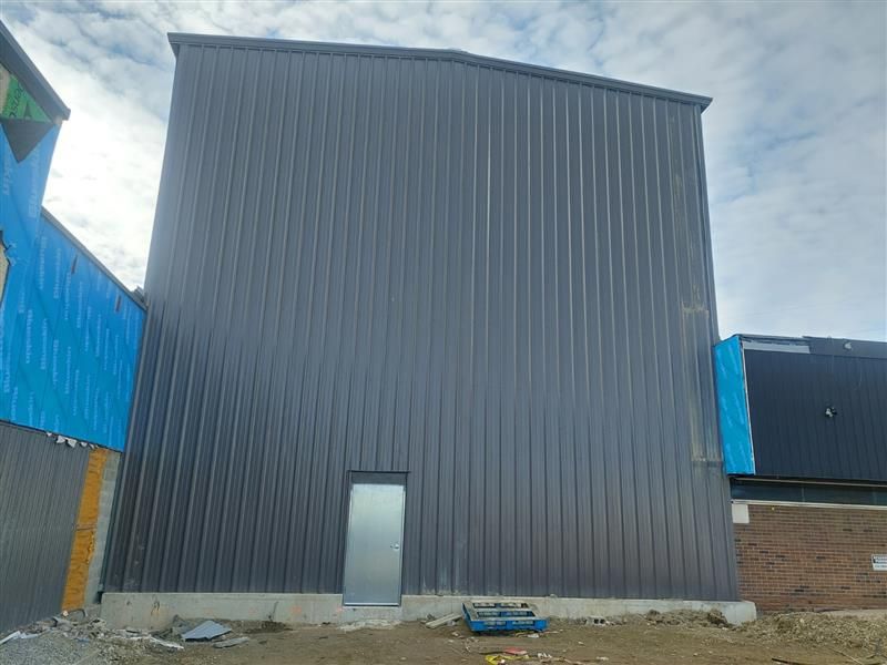 New clad addition connecting to the existing TWI Foods building